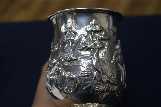 A Victorian embossed silver christening mug, George Angel, London, 1859, 12cm.